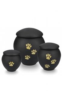 Black pet urn with gold coloured paws