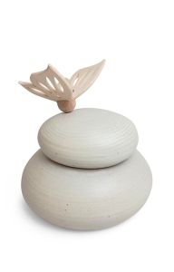 Natural coloured handmade cremation urn with wooden butterfly