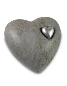 Grey cremation urn for ashes with silver coloured heart