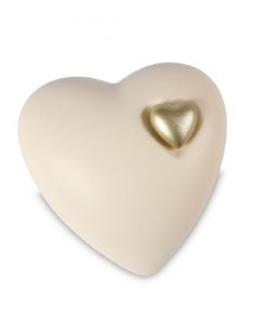 Beige cremation urn for ashes with gold coloured heart