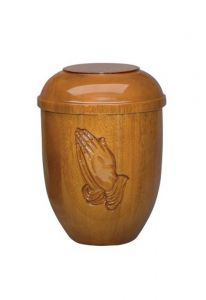 Wooden funeral urn hands