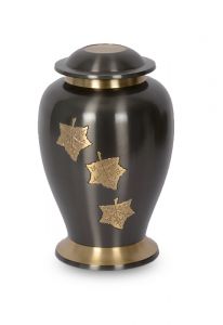 Cast brass cremation urn for ashes with golden leaves