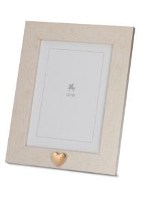 Photo frame urn with small golden heart for ashes