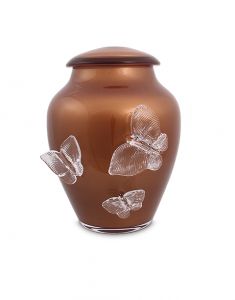Rusty brown crystal glass cremation urn with butterflies