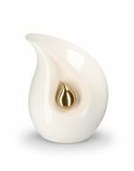 Teardrop cremation urn for ashes made of white ceramic with small gold-coloured teardrop